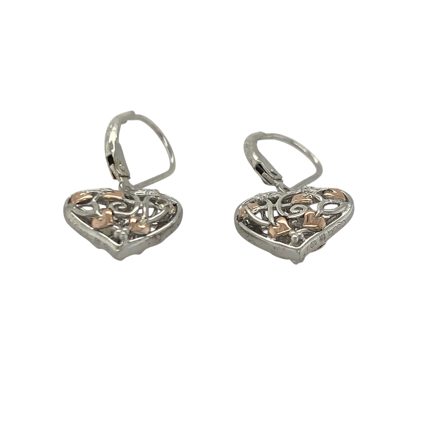 Add a touch of Welsh-inspired magic and symbolic elegance to your jewellery collection with these pre-owned sterling silver and 9ct rose gold Clogau Tree of Life Fairy Heart drop earrings, featuring a beautifully detailed design with timeless appeal—perfect for gifting, special occasions, or refined everyday wear.

Design: The earrings showcase an enchanting Fairy Heart design incorporating the iconic Tree of Life motif, creating a graceful and eye-catching look.