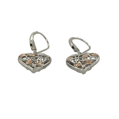 Add a touch of Welsh-inspired magic and symbolic elegance to your jewellery collection with these pre-owned sterling silver and 9ct rose gold Clogau Tree of Life Fairy Heart drop earrings, featuring a beautifully detailed design with timeless appeal—perfect for gifting, special occasions, or refined everyday wear.

Design: The earrings showcase an enchanting Fairy Heart design incorporating the iconic Tree of Life motif, creating a graceful and eye-catching look.