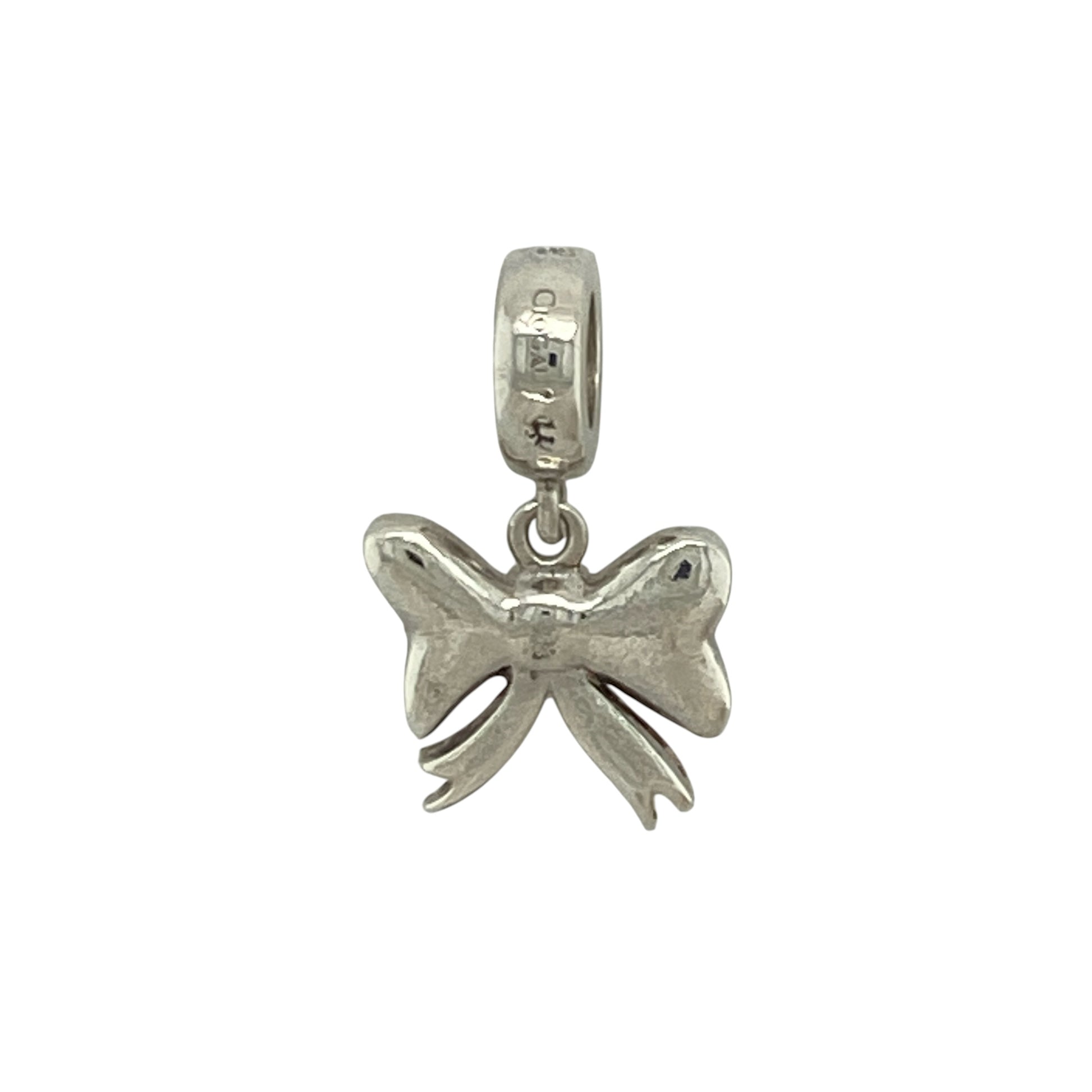 Add a touch of Welsh-inspired elegance and feminine charm to your jewellery collection with this pre-owned sterling silver and 9ct rose gold Clogau bow charm, featuring a beautifully crafted design with timeless appeal—perfect for collectors, gifting, or personalising a favourite bracelet or necklace.

Design: The charm showcases an elegant bow motif, beautifully detailed to create a graceful and sophisticated appearance.