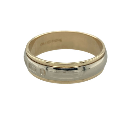 Add distinctive style and timeless elegance to your jewellery collection with this pre-owned 9ct yellow and white gold hallmark detail band ring, featuring a striking two-tone design with sophisticated everyday appeal—perfect for weddings, anniversaries, gifting, or daily wear.

Design: The ring features an attractive two-tone band measuring approximately 6mm wide, with a polished white gold centre bordered by yellow gold edges.
