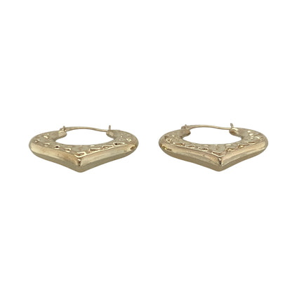 Add a touch of romance and timeless charm to your jewellery collection with these pre-owned 9ct yellow gold patterned heart creole earrings, featuring a beautifully detailed design with versatile everyday appeal—perfect for gifting, special occasions, or adding a feminine touch to any outfit.

Design: The earrings feature elegant heart-shaped creole hoops enhanced with attractive patterned detailing, creating a distinctive and eye-catching look.