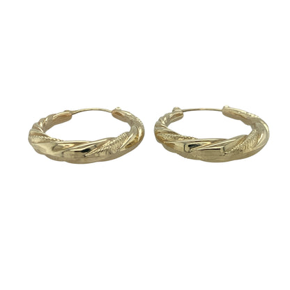 Add timeless elegance and stylish texture to your jewellery collection with these pre-owned 9ct yellow gold twisted hoop creole earrings, featuring a classic design with versatile everyday appeal—perfect for gifting, daily wear, or complementing any jewellery collection.

Design: The earrings feature a traditional hoop creole silhouette enhanced with an attractive twisted design, creating beautiful texture and light-catching detail.