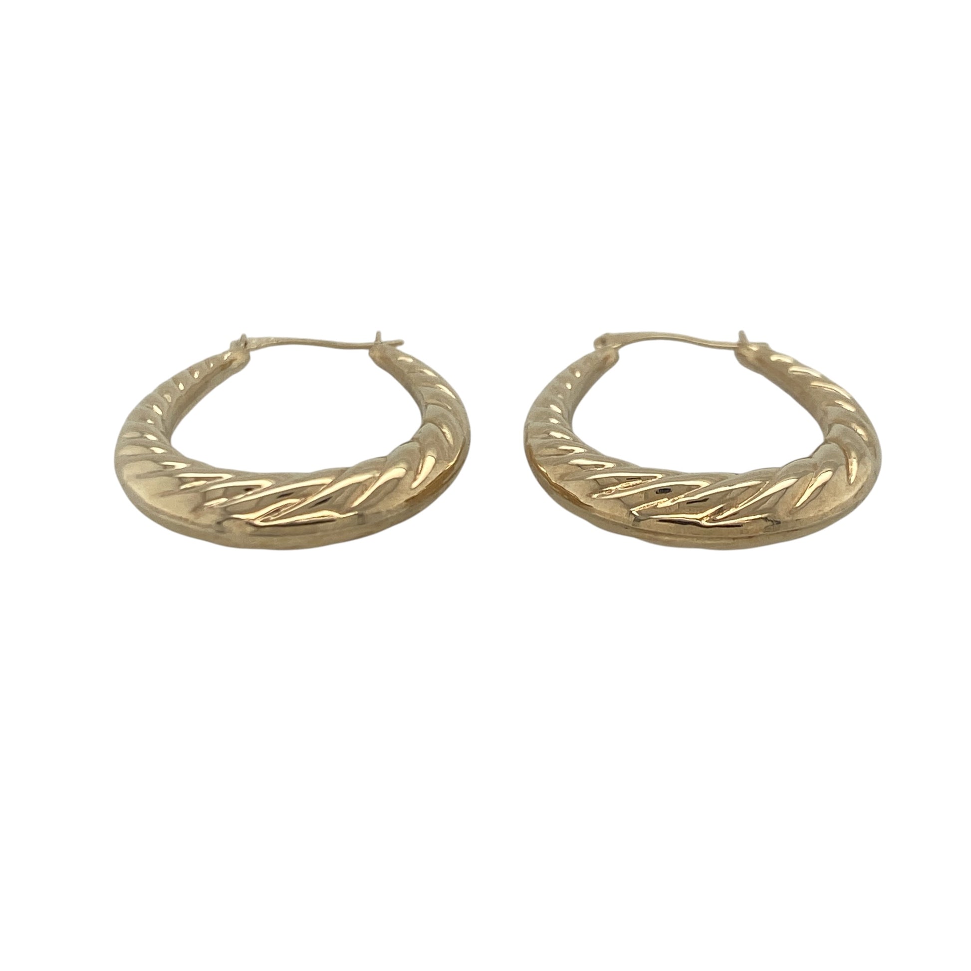 Add timeless elegance and effortless style to your jewellery collection with these pre-owned 9ct yellow gold twisted oval creole earrings, featuring a classic design with a decorative twist and versatile everyday appeal—perfect for gifting, daily wear, or complementing any jewellery collection.

Design: The earrings feature a graceful oval creole shape enhanced with attractive twisted detailing, creating a beautiful interplay of texture and light.