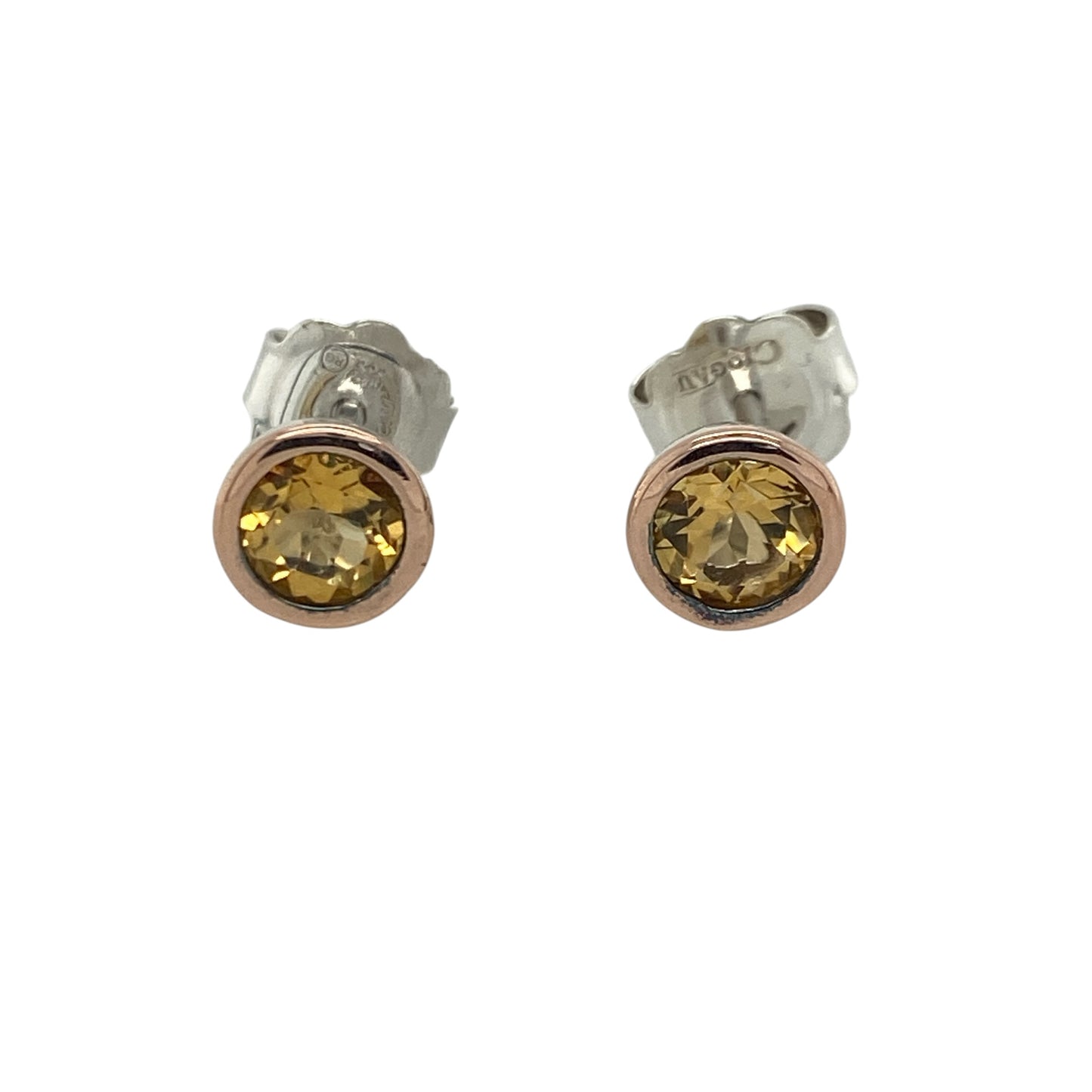 Add a touch of Welsh-inspired elegance and warm gemstone colour to your jewellery collection with these pre-owned sterling silver, 9ct rose gold and citrine Clogau stud earrings, featuring a timeless design with versatile everyday appeal—perfect for gifting, special occasions, or refined daily wear.

Design: The earrings showcase beautiful round citrine gemstones, each measuring approximately 5mm in diameter.