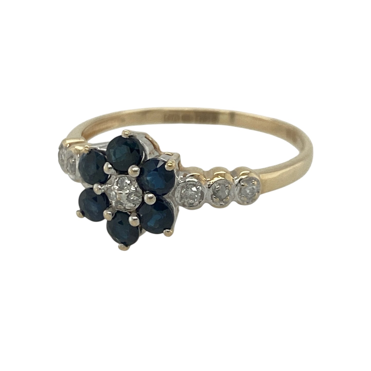 Add timeless elegance and vibrant colour to your jewellery collection with this pre-owned 9ct yellow gold diamond and sapphire flower cluster ring, featuring a charming floral design with refined everyday appeal—perfect for special occasions, gifting, or sophisticated daily wear.

Design: The ring showcases a beautiful flower cluster design measuring approximately 9mm high at the front.