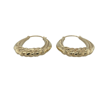 Add timeless elegance and decorative detail to your jewellery collection with these pre-owned 9ct yellow gold twisted patterned oval creole earrings, featuring a classic design with versatile everyday appeal—perfect for gifting, daily wear, or complementing any jewellery collection.

Design: The earrings feature an elegant oval creole shape enhanced with attractive twisted and patterned detailing, creating a beautiful combination of texture and light-catching sparkle.