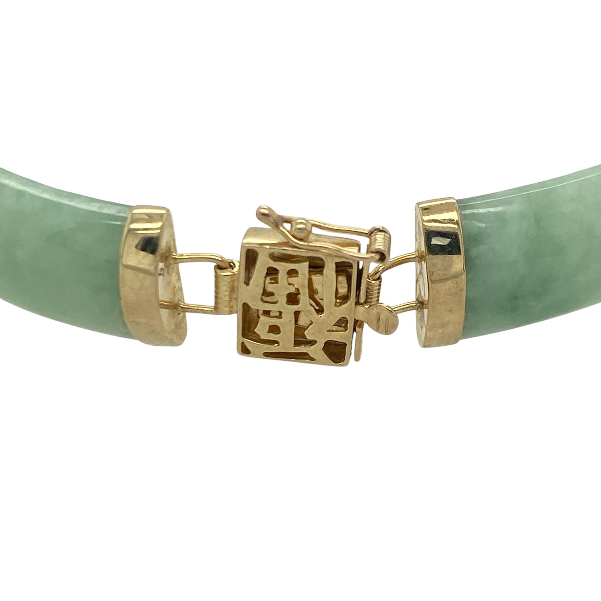 Add a touch of elegance and cultural inspiration to your jewellery collection with this pre-owned 9ct yellow gold and jade oriental style bracelet, featuring a striking design with timeless appeal—perfect for special occasions, gifting, or treasured everyday wear.

Design: The bracelet showcases a series of beautifully polished curved jade bars, each measuring approximately 15mm by 9mm, linked together to create a graceful and distinctive oriental-inspired design.