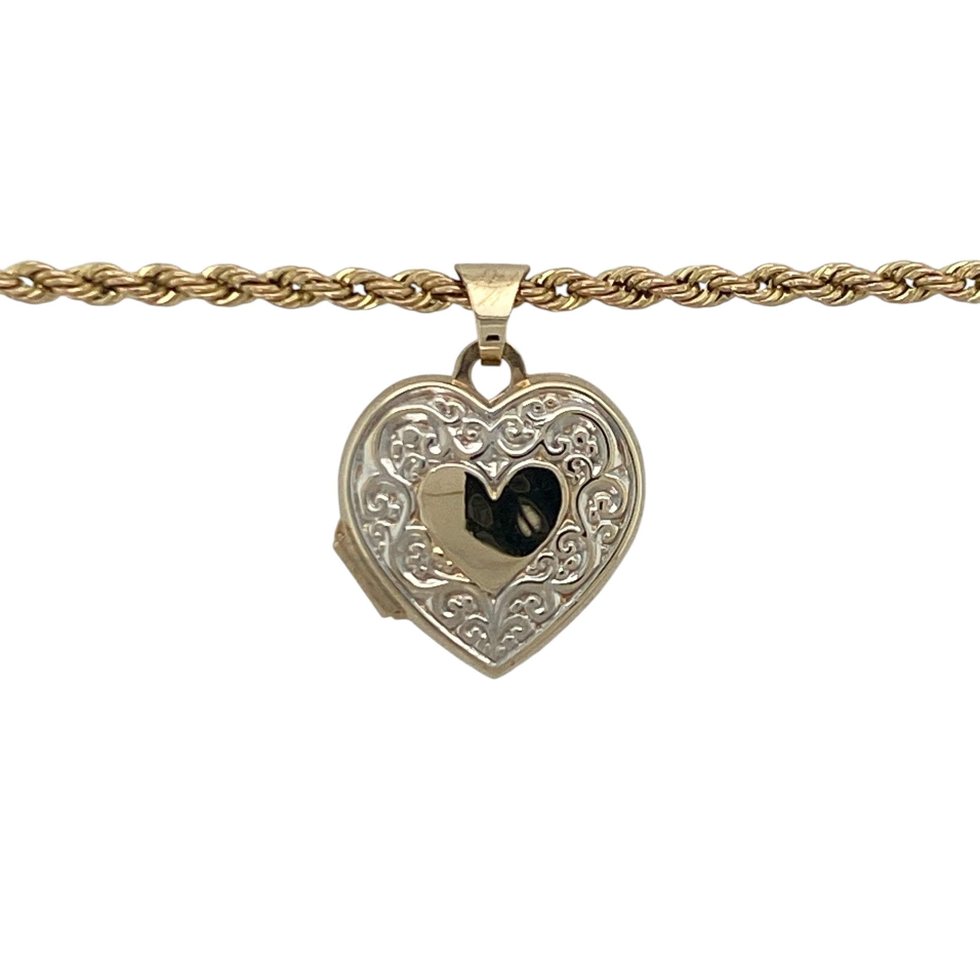 Add a touch of romance and timeless sentiment to your jewellery collection with this pre-owned 9ct yellow and white gold patterned heart locket necklace, featuring a beautifully detailed design with meaningful everyday appeal—perfect for gifting, keepsakes, or treasured personal wear.

Design: The necklace features an elegant heart-shaped locket adorned with attractive patterned detailing, creating a charming and eye-catching appearance.