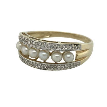 Add timeless elegance and classic charm to your jewellery collection with this pre-owned 9ct yellow gold diamond and pearl band ring, featuring a sophisticated design with refined everyday appeal—perfect for special occasions, gifting, or treasured daily wear.

Design: The ring showcases a beautifully crafted band measuring approximately 9mm wide at the front, adorned with lustrous pearls and sparkling diamond accents.