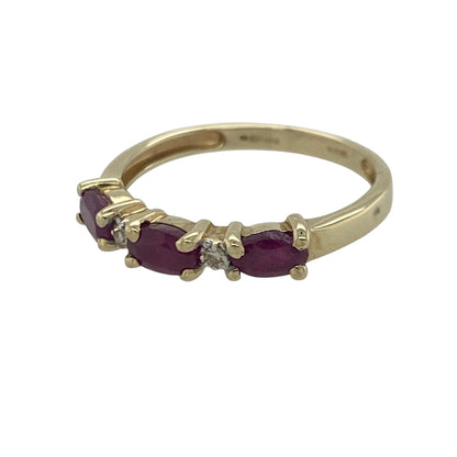 Add a touch of vibrant colour and timeless elegance to your jewellery collection with this pre-owned 9ct yellow gold diamond and ruby band ring, featuring a classic gemstone design with refined everyday appeal—perfect for special occasions, gifting, or sophisticated daily wear.

Design: The ring showcases a beautiful arrangement of oval ruby gemstones, each measuring approximately 5mm by 3mm, creating a striking display of rich red colour across the band.