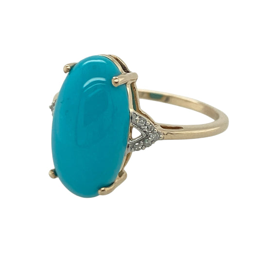 Add a bold splash of colour and timeless elegance to your jewellery collection with this pre-owned 9ct yellow gold diamond and turquoise ring, featuring a striking gemstone design with distinctive character and everyday appeal—perfect for special occasions, gifting, or statement wear.

Design: The ring showcases an impressive oval turquoise stone measuring approximately 17mm by 9mm, creating a vibrant focal point with its beautiful blue-green tones.