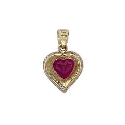 Add a touch of romance and vibrant colour to your jewellery collection with this pre-owned 9ct yellow gold diamond and ruby heart pendant, featuring a beautiful gemstone design with timeless appeal—perfect for gifting, special occasions, or treasured everyday wear.

Design: The pendant showcases a stunning heart-shaped ruby measuring approximately 7mm, creating a striking focal point with its rich red colour and romantic symbolism.