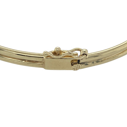 Add a touch of Welsh heritage and timeless elegance to your jewellery collection with this pre-owned 9ct yellow and rose gold Clogau hinged Vine/Tree of Life bangle, featuring a beautifully detailed design with meaningful everyday appeal—perfect for gifting, special occasions, or treasured daily wear.

Design: The bangle showcases an elegant Vine and Tree of Life inspired design measuring approximately 11mm high at the front