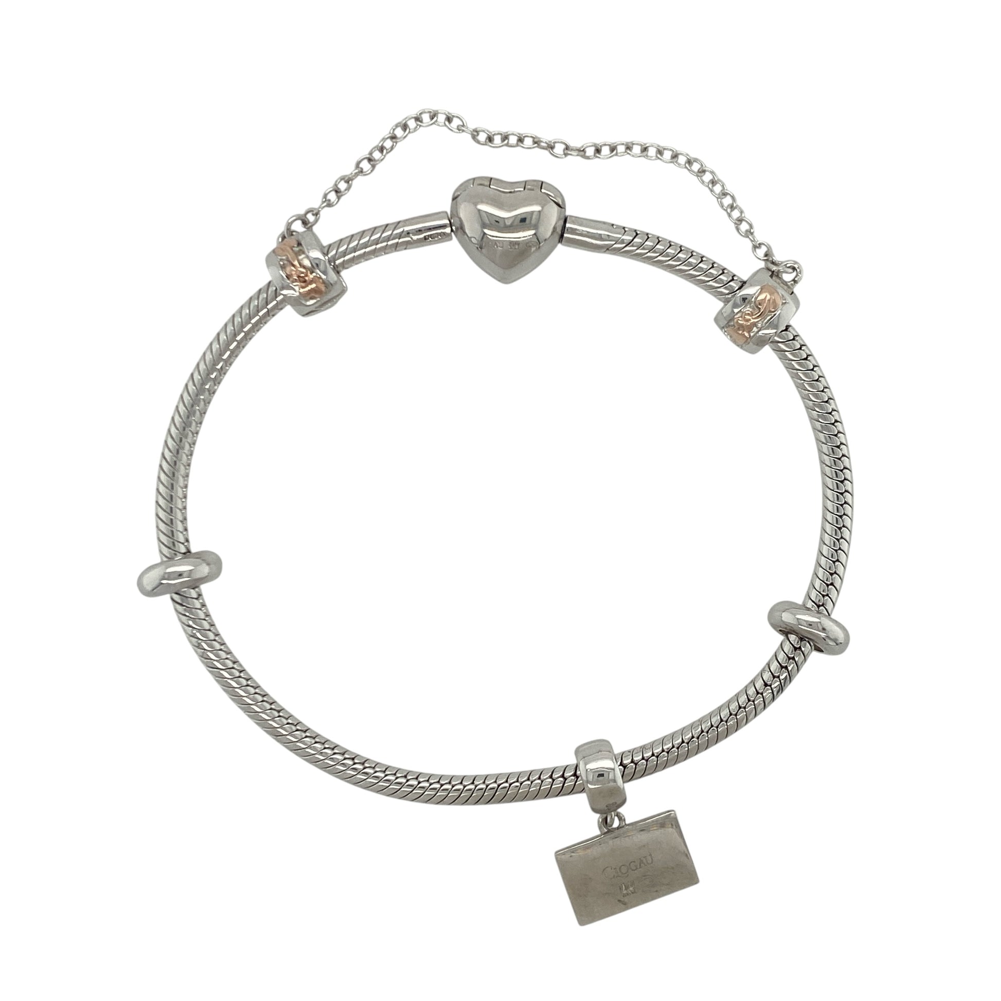 Add a touch of Welsh heritage and personal style to your jewellery collection with this pre-owned sterling silver and 9ct rose gold Clogau charm bracelet, featuring meaningful charms and timeless appeal—perfect for everyday wear, gifting, or as a treasured keepsake.

Design: The bracelet features a classic charm bracelet design complete with a selection of Clogau charms, including a Tree of Life safety charm, two decorative stoppers, and a Clogau ID-style charm engraved with the word "Love".