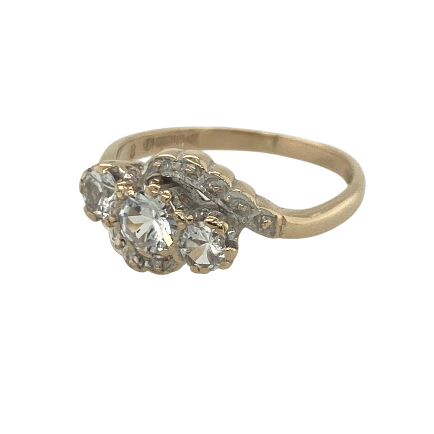 Add a touch of sparkle and elegance to your jewellery collection with this pre-owned 9ct yellow and white gold cubic zirconia twist trilogy ring, featuring a sophisticated two-tone design with timeless appeal—perfect for special occasions, gifting, or everyday wear.

Design: The ring showcases a beautiful trilogy arrangement centred around a striking round cubic zirconia measuring approximately 4mm in diameter.