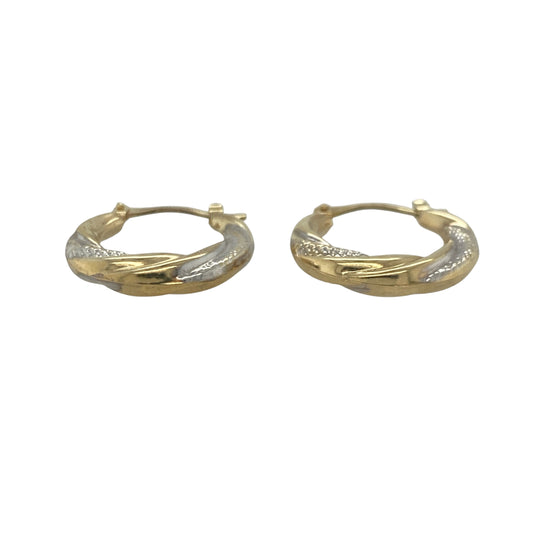 Add a touch of sophistication to your jewellery collection with these pre-owned 9ct yellow and white gold textured twisted hoop creole earrings, featuring an elegant two-tone design with timeless appeal—perfect for everyday wear, special occasions, or gifting.

Design: The earrings showcase a stylish twisted hoop creole design, enhanced by textured detailing that catches and reflects the light beautifully.