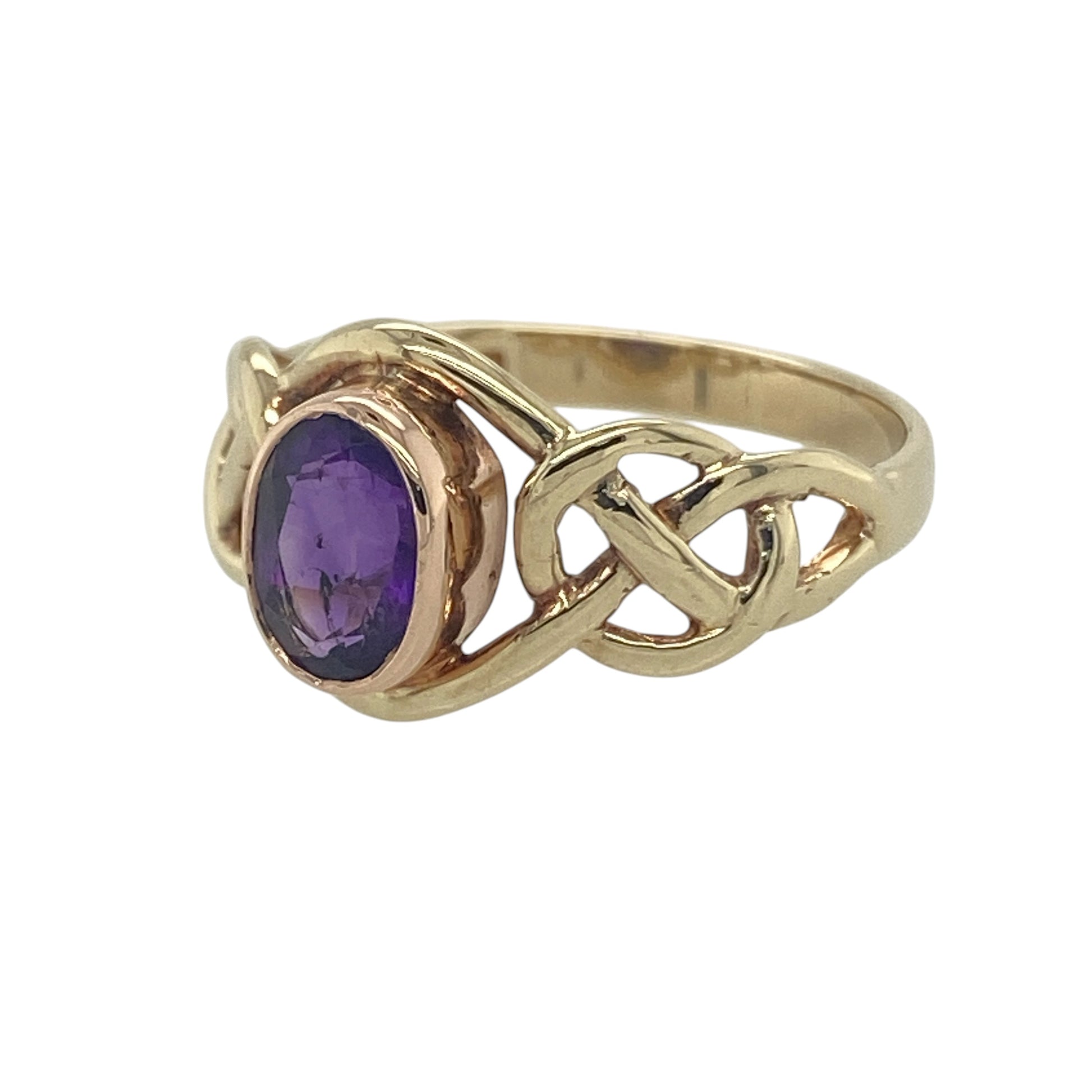 Celebrate Celtic heritage and timeless elegance with this pre-owned 9ct yellow and rose gold amethyst set Clogau Celtic Knot birthstone ring. Featuring a beautiful February birthstone and the iconic Celtic Knot design, this distinctive ring is perfect for everyday wear, a meaningful birthday gift, or a treasured addition to any Clogau jewellery collection.

Design: The ring showcases a 6mm by 4mm oval-cut amethyst, displaying rich violet hues that bring colour and sophistication to the elegant Celtic Knot