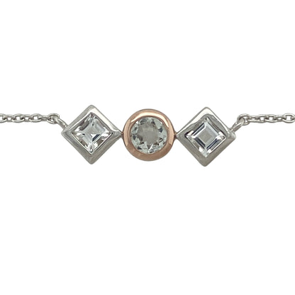 Add a touch of regal elegance to your jewellery collection with this pre-owned Clogau Welsh Royalty white topaz necklace in sterling silver. Featuring a sophisticated three-stone design with sparkling white topaz, this beautiful necklace is inspired by royal heritage and timeless style.

Design: The necklace showcases a classic three-stone arrangement, featuring a central round white topaz measuring 5mm in diameter, complemented by two square white topaz stones measuring approximately 4mm by 4mm each