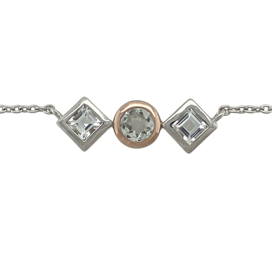 Add a touch of regal elegance to your jewellery collection with this pre-owned Clogau Welsh Royalty white topaz necklace in sterling silver. Featuring a sophisticated three-stone design with sparkling white topaz, this beautiful necklace is inspired by royal heritage and timeless style.

Design: The necklace showcases a classic three-stone arrangement, featuring a central round white topaz measuring 5mm in diameter, complemented by two square white topaz stones measuring approximately 4mm by 4mm each