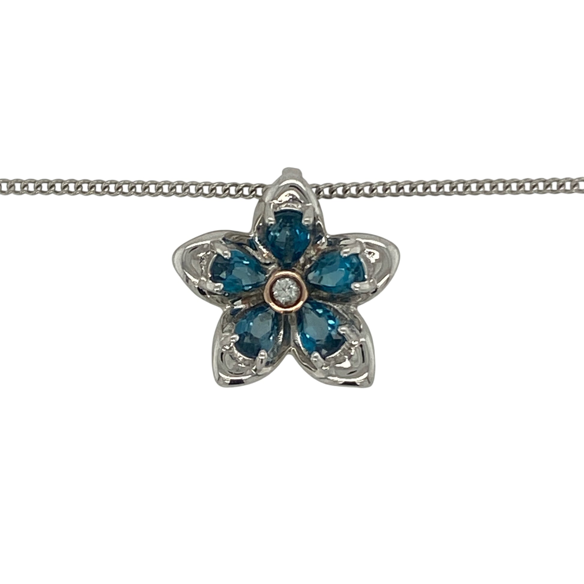 Add a touch of floral elegance to your jewellery collection with this pre-owned Clogau blue stone flower pendant necklace in sterling silver and 9ct rose gold. Featuring a delicate flower design highlighted by a vibrant blue stone, this charming necklace combines timeless beauty with the distinctive style of Clogau jewellery.

Design: The pendant showcases an elegant flower motif centred around a striking blue stone, creating a feminine and eye-catching design inspired by the beauty of nature.