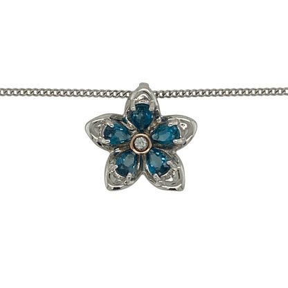 Add a touch of floral elegance to your jewellery collection with this pre-owned Clogau blue stone flower pendant necklace in sterling silver and 9ct rose gold. Featuring a delicate flower design highlighted by a vibrant blue stone, this charming necklace combines timeless beauty with the distinctive style of Clogau jewellery.

Design: The pendant showcases an elegant flower motif centred around a striking blue stone, creating a feminine and eye-catching design inspired by the beauty of nature.