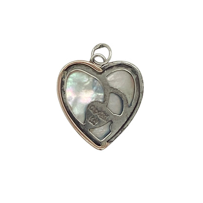 Celebrate love and timeless elegance with this pre-owned Clogau heart pendant in sterling silver and 9ct rose gold. Featuring a beautiful mother of pearl heart centre, this charming pendant combines soft iridescent tones with the distinctive Welsh-inspired style that makes Clogau jewellery so sought after.

Design: The pendant showcases a classic heart motif centred with a mother of pearl heart, creating a romantic and feminine design that symbolises love, affection, and treasured memories.