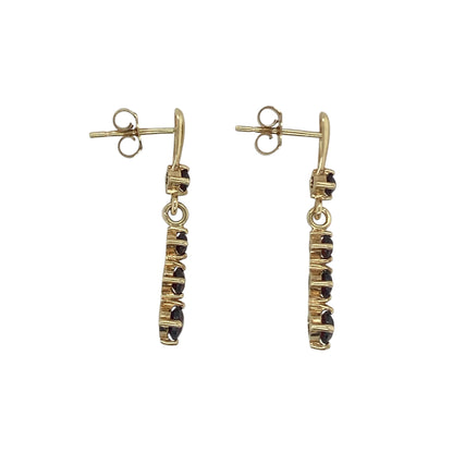 Add rich colour and timeless elegance to your jewellery collection with these pre-owned 9ct yellow gold garnet drop earrings. Featuring four round garnet gemstones in each earring, these elegant drops offer beautiful movement and deep red tones that are perfect for both everyday wear and special occasions.

Design: The earrings showcase a graceful drop design, each adorned with four round garnet stones arranged to create an eye-catching display of colour and sparkle.