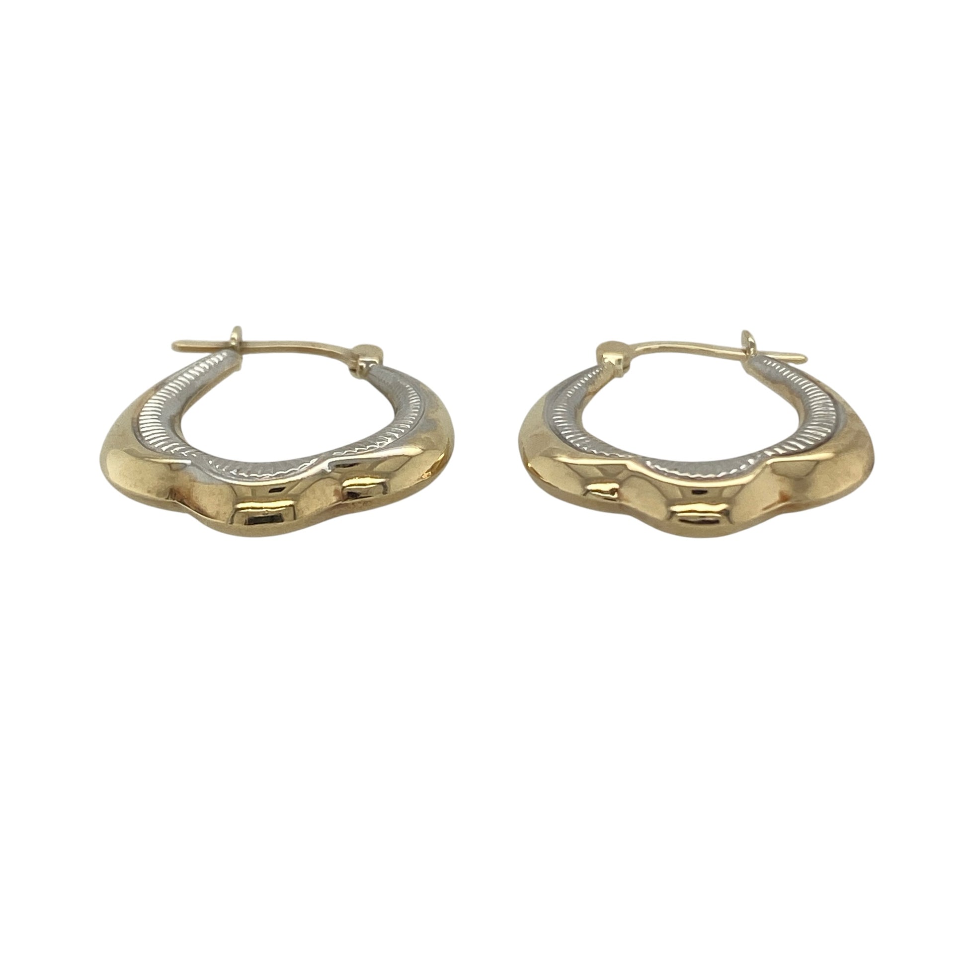 Add versatile elegance to your jewellery collection with these pre-owned 9ct yellow and white gold patterned creole earrings. Featuring attractive textured detailing and a two-tone gold design, these classic creole earrings are perfect for everyday wear and effortlessly complement both yellow and white gold jewellery.

Design: The earrings showcase a timeless creole style enhanced by decorative patterned detailing, creating texture and sparkle as they catch the light.