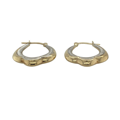 Add versatile elegance to your jewellery collection with these pre-owned 9ct yellow and white gold patterned creole earrings. Featuring attractive textured detailing and a two-tone gold design, these classic creole earrings are perfect for everyday wear and effortlessly complement both yellow and white gold jewellery.

Design: The earrings showcase a timeless creole style enhanced by decorative patterned detailing, creating texture and sparkle as they catch the light.