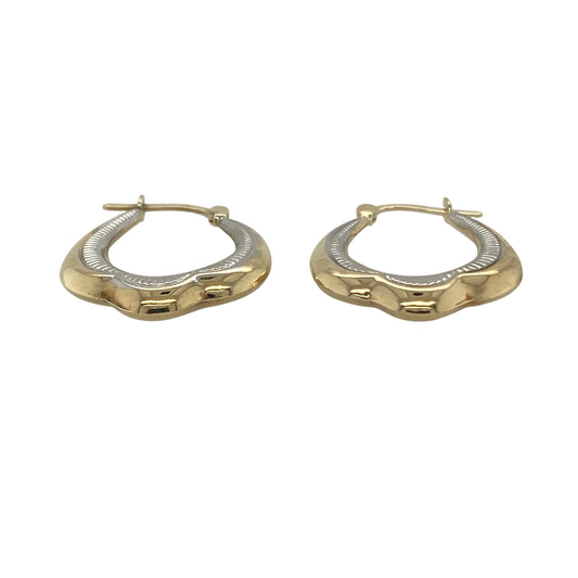 Add versatile elegance to your jewellery collection with these pre-owned 9ct yellow and white gold patterned creole earrings. Featuring attractive textured detailing and a two-tone gold design, these classic creole earrings are perfect for everyday wear and effortlessly complement both yellow and white gold jewellery.

Design: The earrings showcase a timeless creole style enhanced by decorative patterned detailing, creating texture and sparkle as they catch the light.