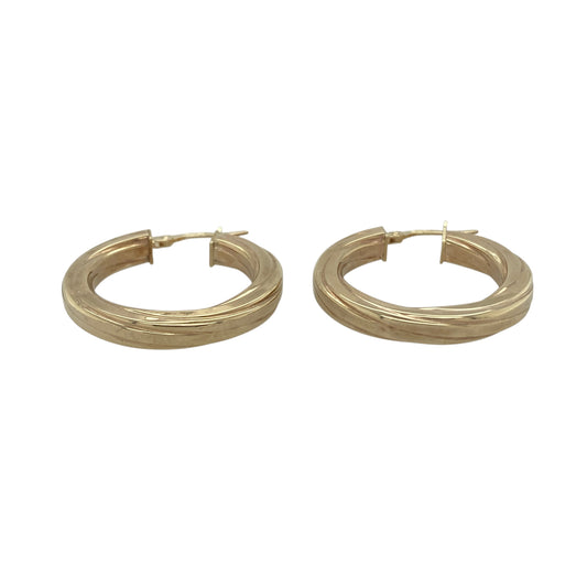 Add timeless style and elegant detailing to your jewellery collection with these pre-owned 9ct yellow gold twisted hoop creole earrings. Featuring a classic hoop silhouette enhanced by a distinctive twisted design, these versatile earrings are perfect for everyday wear and special occasions alike.

Design: The earrings showcase a traditional creole hoop style with an attractive twisted profile, creating texture and dimension that catches the light beautifully.
