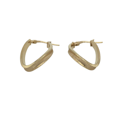 Add elegant movement and timeless style to your jewellery collection with these pre-owned 9ct yellow gold twist long oval creole earrings. Featuring a graceful elongated oval shape with attractive twist detailing, these earrings offer a sophisticated look that is perfect for both everyday wear and special occasions.

Design: The earrings showcase a long oval creole silhouette enhanced by a stylish twisted design.