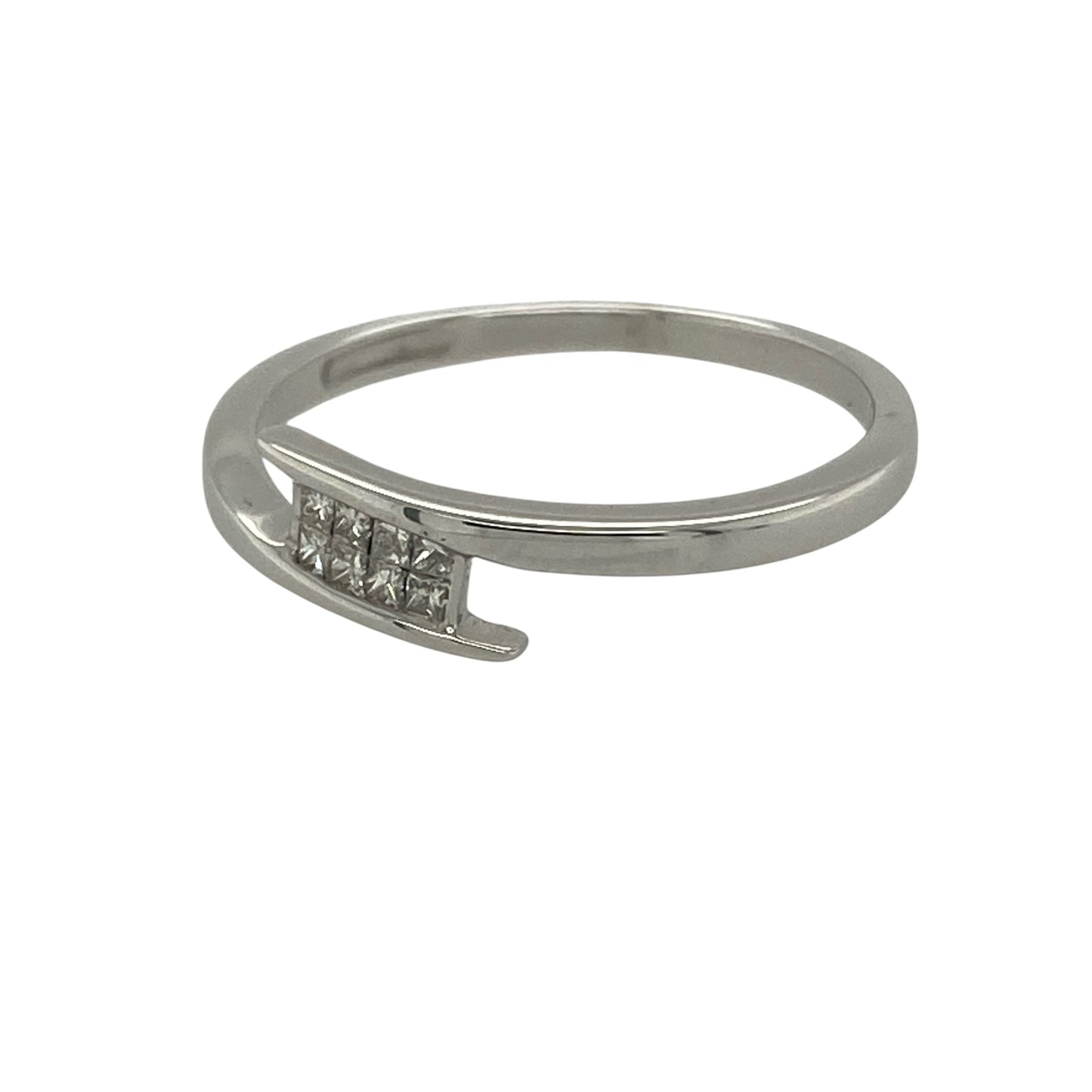 Add contemporary elegance and refined sparkle to your jewellery collection with this pre-owned 18ct white gold diamond wrap over band ring. Featuring a stylish wrap-over design accented by princess-cut diamonds, this sophisticated ring offers a modern take on a classic diamond band.

Design: The ring showcases an elegant wrap-over style band with a 4mm wide front, creating a sleek and contemporary look.
