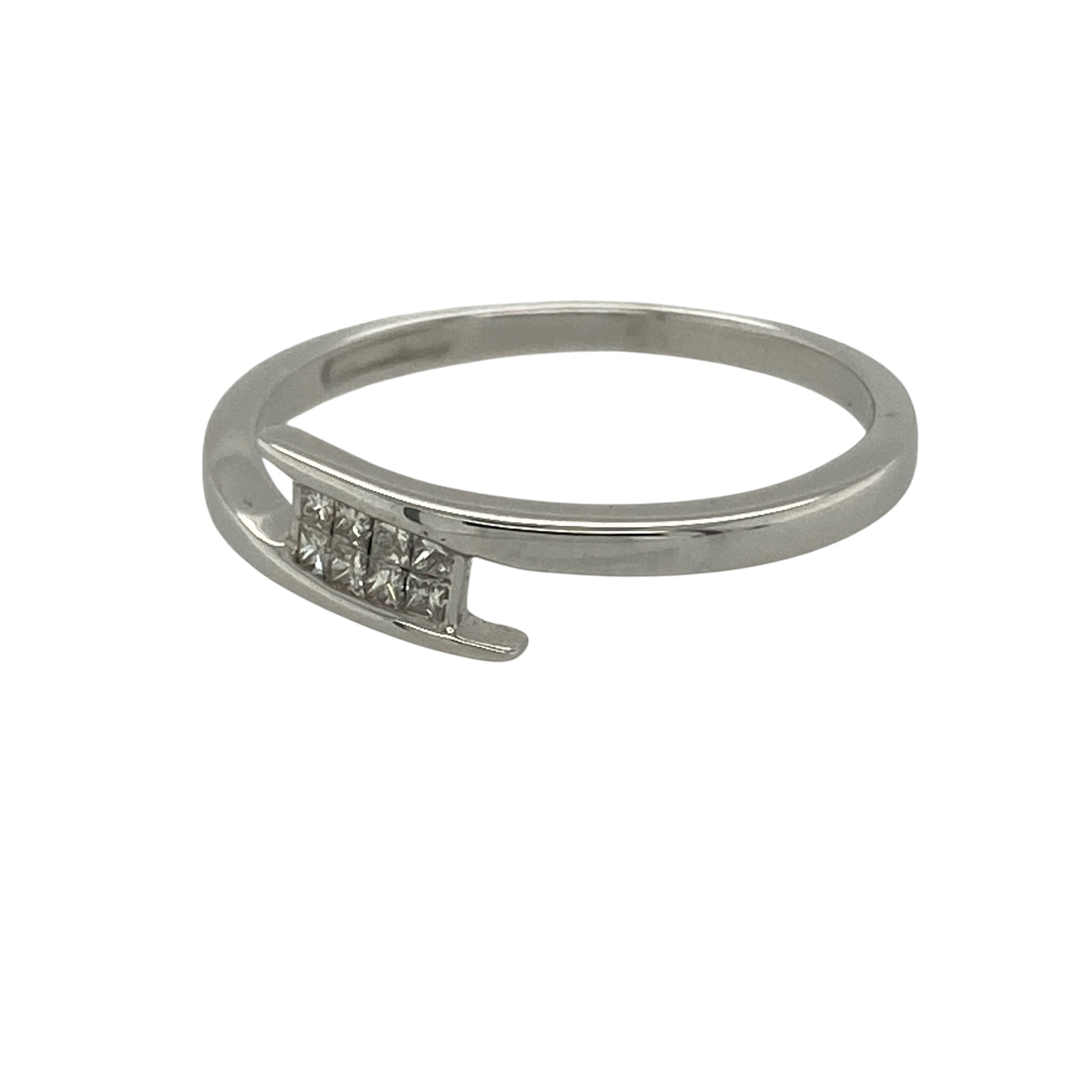 Add contemporary elegance and refined sparkle to your jewellery collection with this pre-owned 18ct white gold diamond wrap over band ring. Featuring a stylish wrap-over design accented by princess-cut diamonds, this sophisticated ring offers a modern take on a classic diamond band.

Design: The ring showcases an elegant wrap-over style band with a 4mm wide front, creating a sleek and contemporary look.