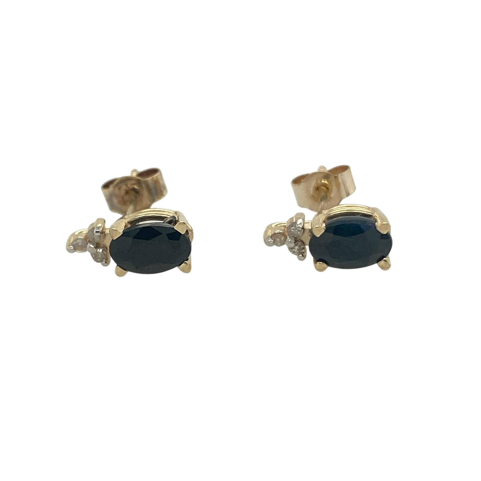 Add timeless colour and elegant sparkle to your jewellery collection with these pre-owned 9ct yellow gold diamond and sapphire stud earrings. Featuring rich blue sapphires complemented by sparkling diamonds, these classic earrings are perfect for everyday wear or special occasions.

Design: The earrings showcase oval-cut sapphire gemstones measuring approximately 6mm by 4mm each, displaying deep blue tones that beautifully catch the light.