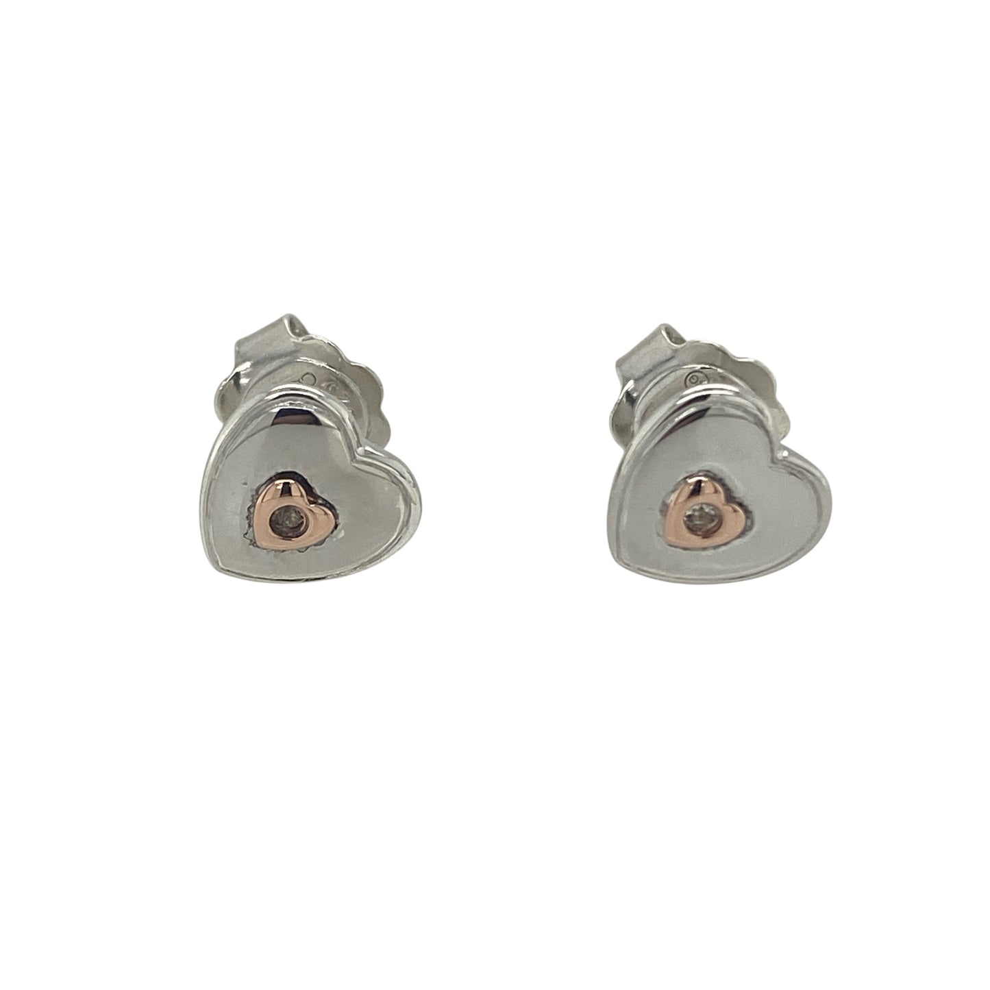Add a touch of romance and Welsh-inspired elegance to your jewellery collection with these pre-owned 925 silver and 9ct rose gold Clogau white topaz heart stud earrings. Featuring the timeless heart motif enhanced by sparkling white topaz and signature rose gold detailing, these beautiful earrings are perfect for everyday wear or gifting to someone special.

Design: The earrings showcase an elegant heart-shaped design, combining polished sterling silver with contrasting 9ct rose gold accents.