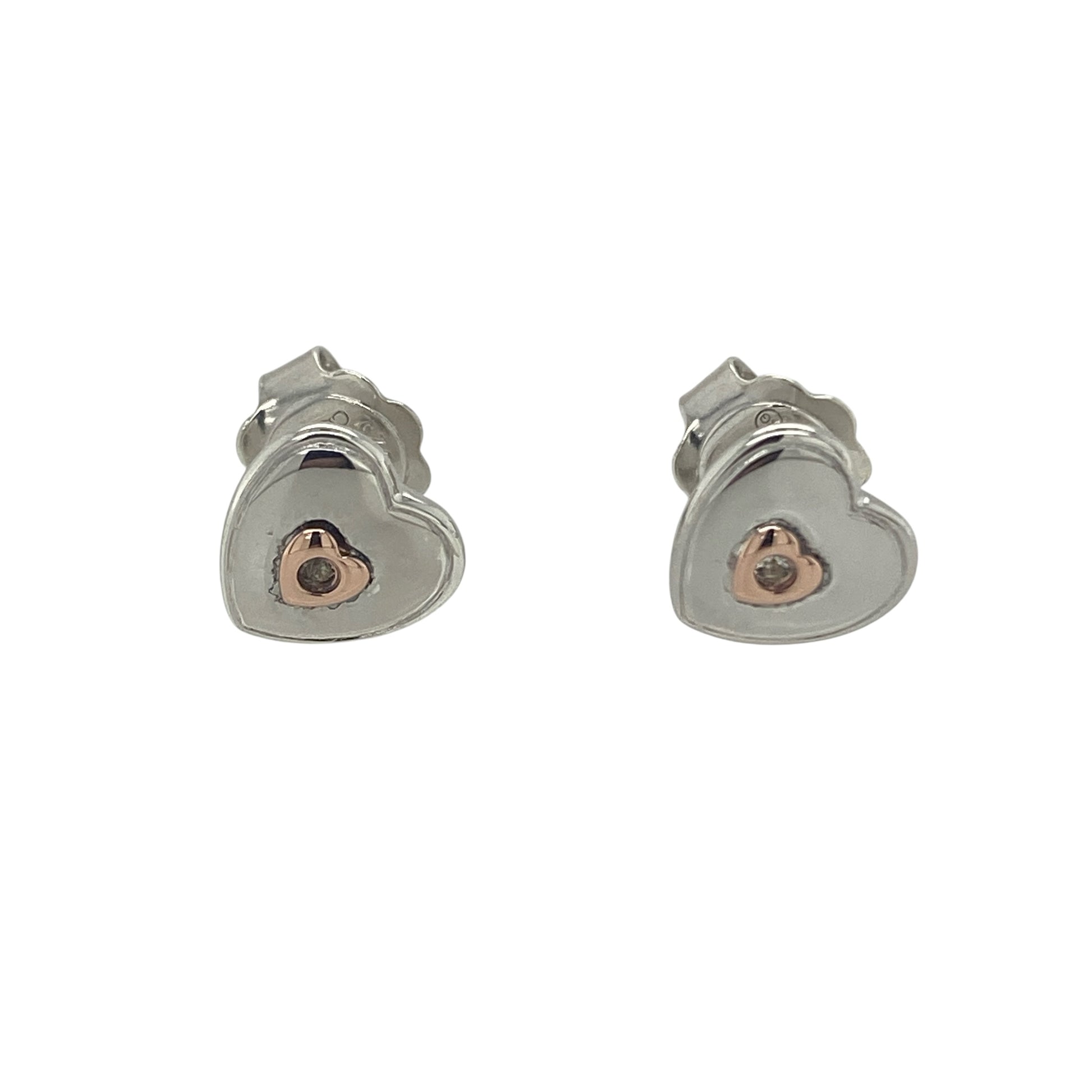Add a touch of romance and Welsh-inspired elegance to your jewellery collection with these pre-owned 925 silver and 9ct rose gold Clogau white topaz heart stud earrings. Featuring the timeless heart motif enhanced by sparkling white topaz and signature rose gold detailing, these beautiful earrings are perfect for everyday wear or gifting to someone special.

Design: The earrings showcase an elegant heart-shaped design, combining polished sterling silver with contrasting 9ct rose gold accents.