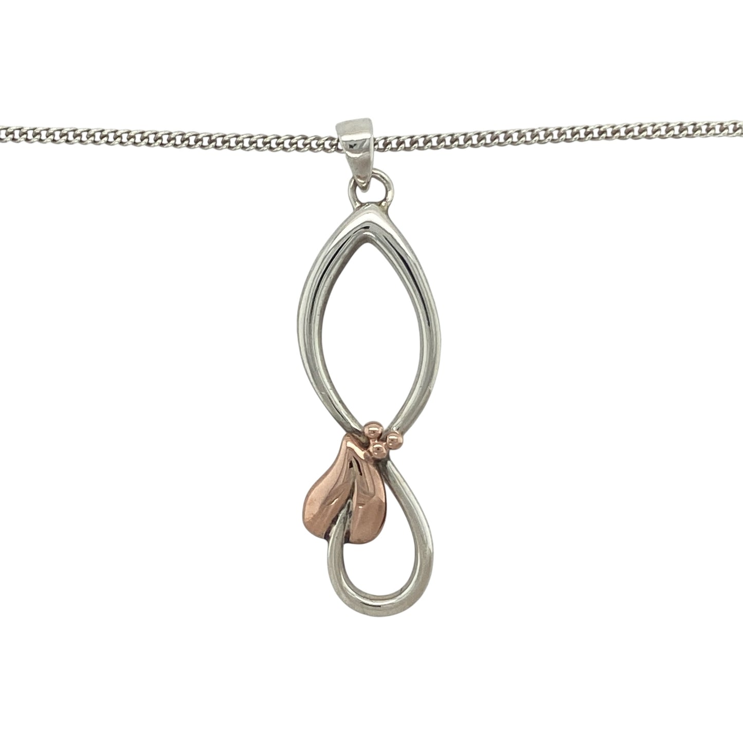 Celebrate Welsh heritage and meaningful symbolism with this pre-owned 925 silver and 9ct rose gold Clogau Tree of Life pendant necklace. Featuring the iconic Tree of Life design suspended from an adjustable genuine Clogau curb chain, this elegant piece symbolises growth, strength, and family connections while offering versatile everyday style.

Design: The pendant showcases Clogau's renowned Tree of Life motif, beautifully combining flowing branches and leaves within an elegant openwork design.