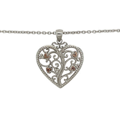 Celebrate love, family, and Welsh heritage with this pre-owned 925 silver and 9ct rose gold Clogau Tree of Life heart pendant necklace. Combining the iconic Tree of Life motif with a timeless heart design, this elegant necklace carries meaningful symbolism while offering versatile everyday style.

Design: The pendant showcases a beautiful heart-shaped design incorporating Clogau's renowned Tree of Life motif.