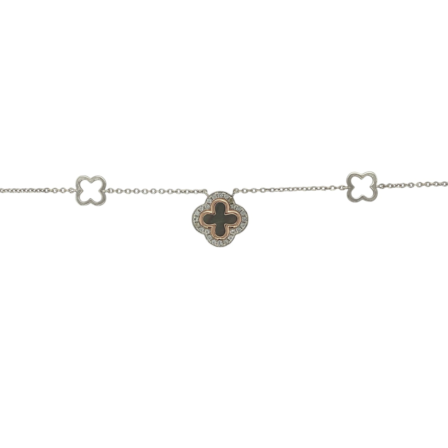 Add a touch of Welsh elegance and symbolic charm to your jewellery collection with this pre-owned 925 silver and 9ct rose gold Clogau Tudor Court Clover necklace. Featuring a beautifully detailed clover design enhanced by a dark mother of pearl centre, this sophisticated necklace combines heritage-inspired styling with timeless appeal.

Design: The necklace showcases the distinctive Tudor Court clover motif, a design inspired by historic Welsh architecture and decorative patterns.