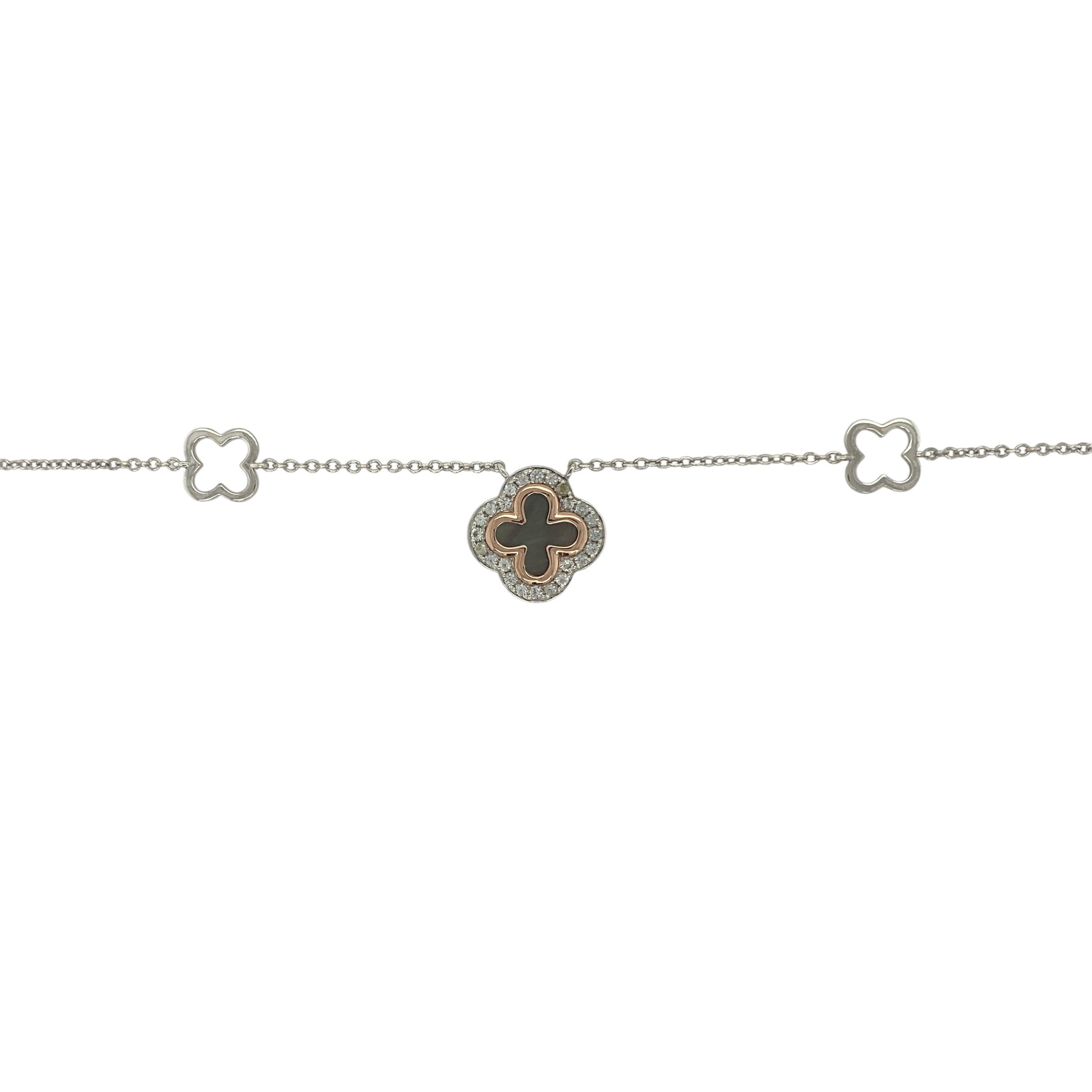 Add a touch of Welsh elegance and symbolic charm to your jewellery collection with this pre-owned 925 silver and 9ct rose gold Clogau Tudor Court Clover necklace. Featuring a beautifully detailed clover design enhanced by a dark mother of pearl centre, this sophisticated necklace combines heritage-inspired styling with timeless appeal.

Design: The necklace showcases the distinctive Tudor Court clover motif, a design inspired by historic Welsh architecture and decorative patterns.