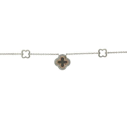 Add a touch of Welsh elegance and symbolic charm to your jewellery collection with this pre-owned 925 silver and 9ct rose gold Clogau Tudor Court Clover necklace. Featuring a beautifully detailed clover design enhanced by a dark mother of pearl centre, this sophisticated necklace combines heritage-inspired styling with timeless appeal.

Design: The necklace showcases the distinctive Tudor Court clover motif, a design inspired by historic Welsh architecture and decorative patterns.