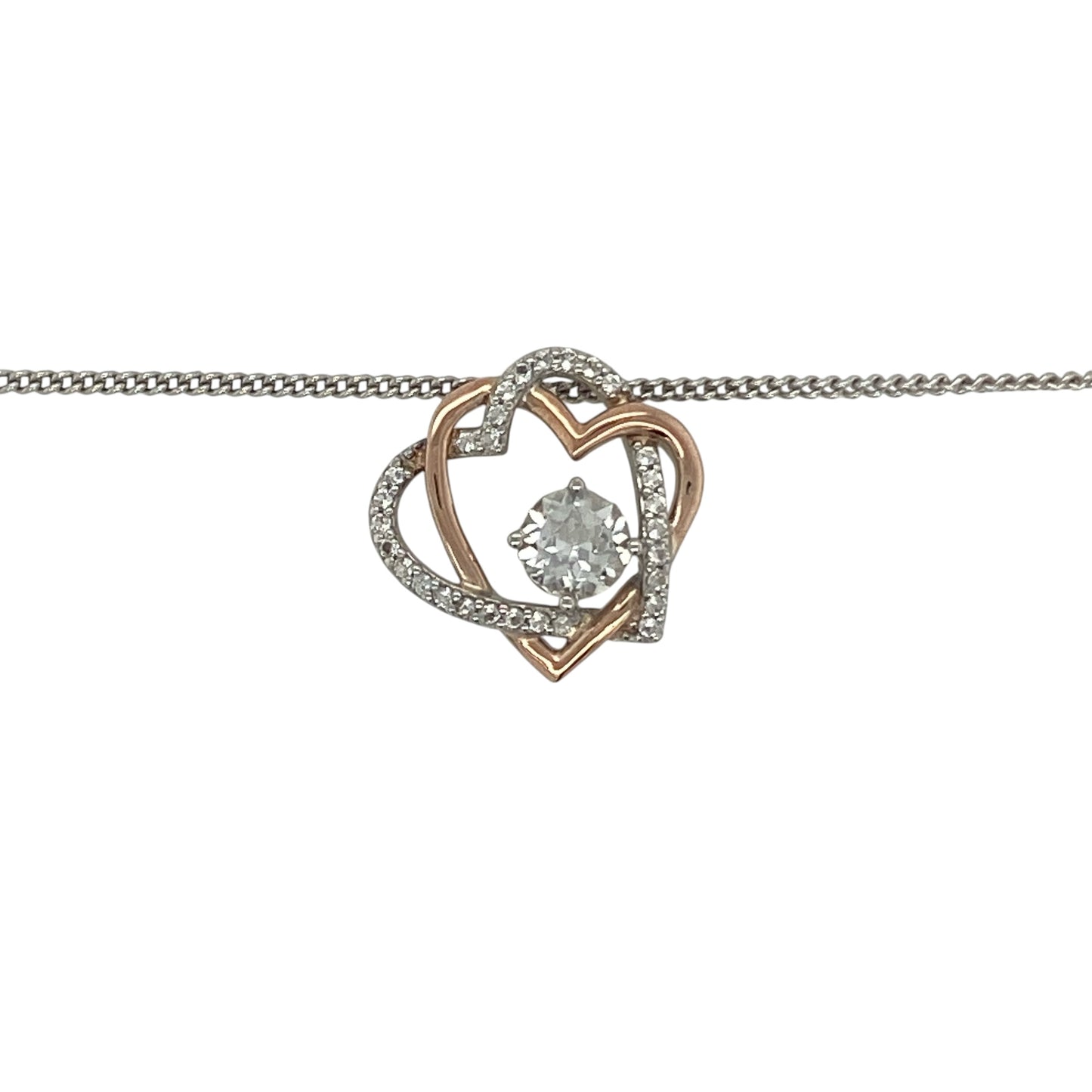 Celebrate love and timeless elegance with this pre-owned 925 silver and 9ct rose gold Clogau double heart pendant necklace. Featuring two intertwined hearts accented with sparkling white topaz, this beautiful necklace combines meaningful symbolism with the distinctive Welsh-inspired styling of Clogau jewellery.

Design: The pendant showcases an elegant double heart motif, symbolising love, friendship, and lasting connections.