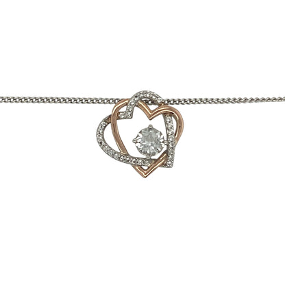 Celebrate love and timeless elegance with this pre-owned 925 silver and 9ct rose gold Clogau double heart pendant necklace. Featuring two intertwined hearts accented with sparkling white topaz, this beautiful necklace combines meaningful symbolism with the distinctive Welsh-inspired styling of Clogau jewellery.

Design: The pendant showcases an elegant double heart motif, symbolising love, friendship, and lasting connections.