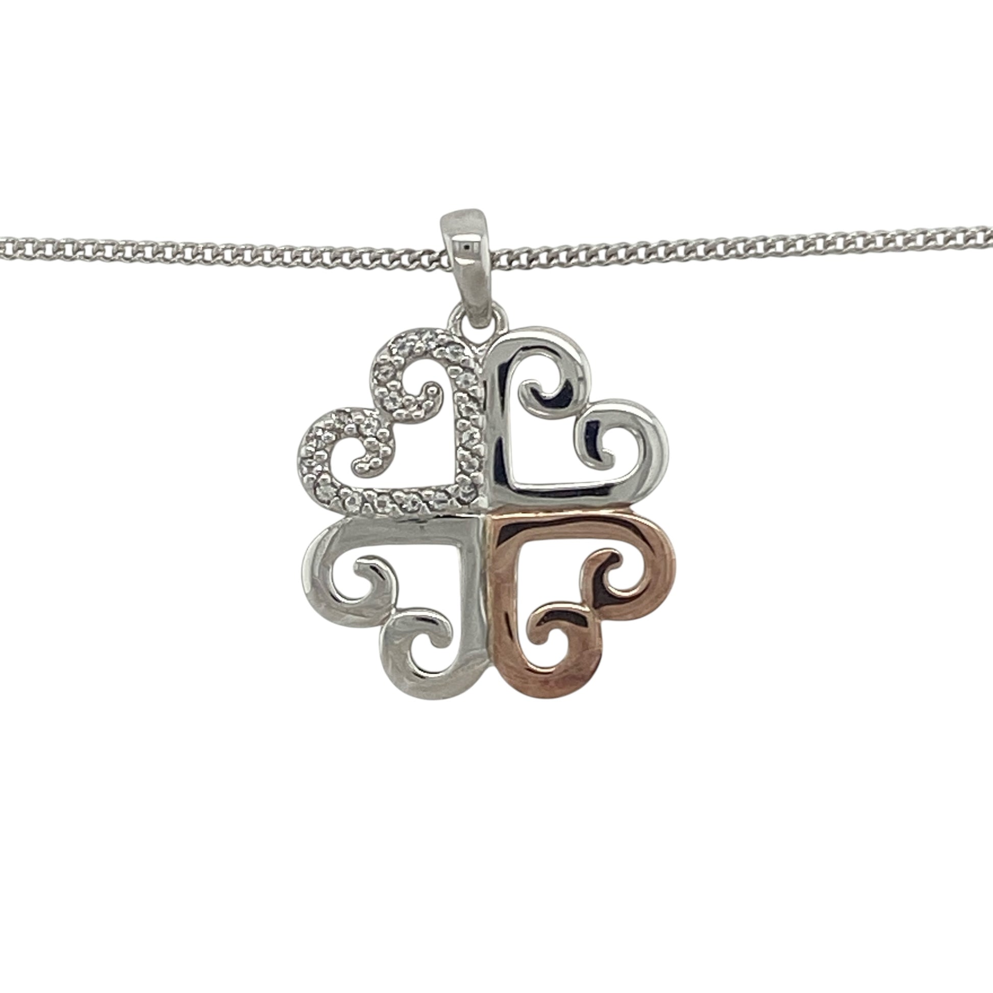 Add a touch of luck and Welsh elegance to your jewellery collection with this pre-owned 925 silver and 9ct rose gold Clogau white topaz clover pendant necklace. Featuring a beautifully detailed clover motif accented with sparkling white topaz, this charming necklace combines meaningful symbolism with the distinctive styling of Clogau jewellery.

Design: The pendant showcases an elegant clover-inspired design, symbolising luck, prosperity, and good fortune.