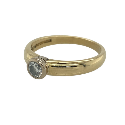 Experience timeless sophistication with this pre-owned 18ct yellow gold diamond solitaire ring. Featuring a beautifully presented brilliant-cut diamond in a modern rubover setting, this elegant ring combines classic luxury with contemporary styling.

Design: The ring showcases a single brilliant-cut diamond, securely held within a sleek rubover setting that enhances both the stone's beauty and durability.