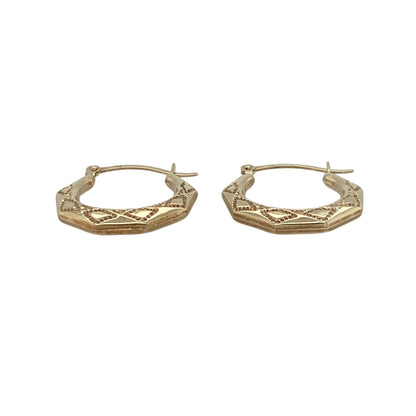 Add a unique geometric touch to your jewellery collection with these pre-owned 9ct yellow gold patterned octagon-shaped creole earrings. Combining a classic hoop style with an attractive octagonal profile and decorative patterning, these earrings offer a distinctive twist on a timeless favourite.

Design: The earrings feature an elegant octagon-shaped creole design, providing a stylish alternative to traditional round hoops.