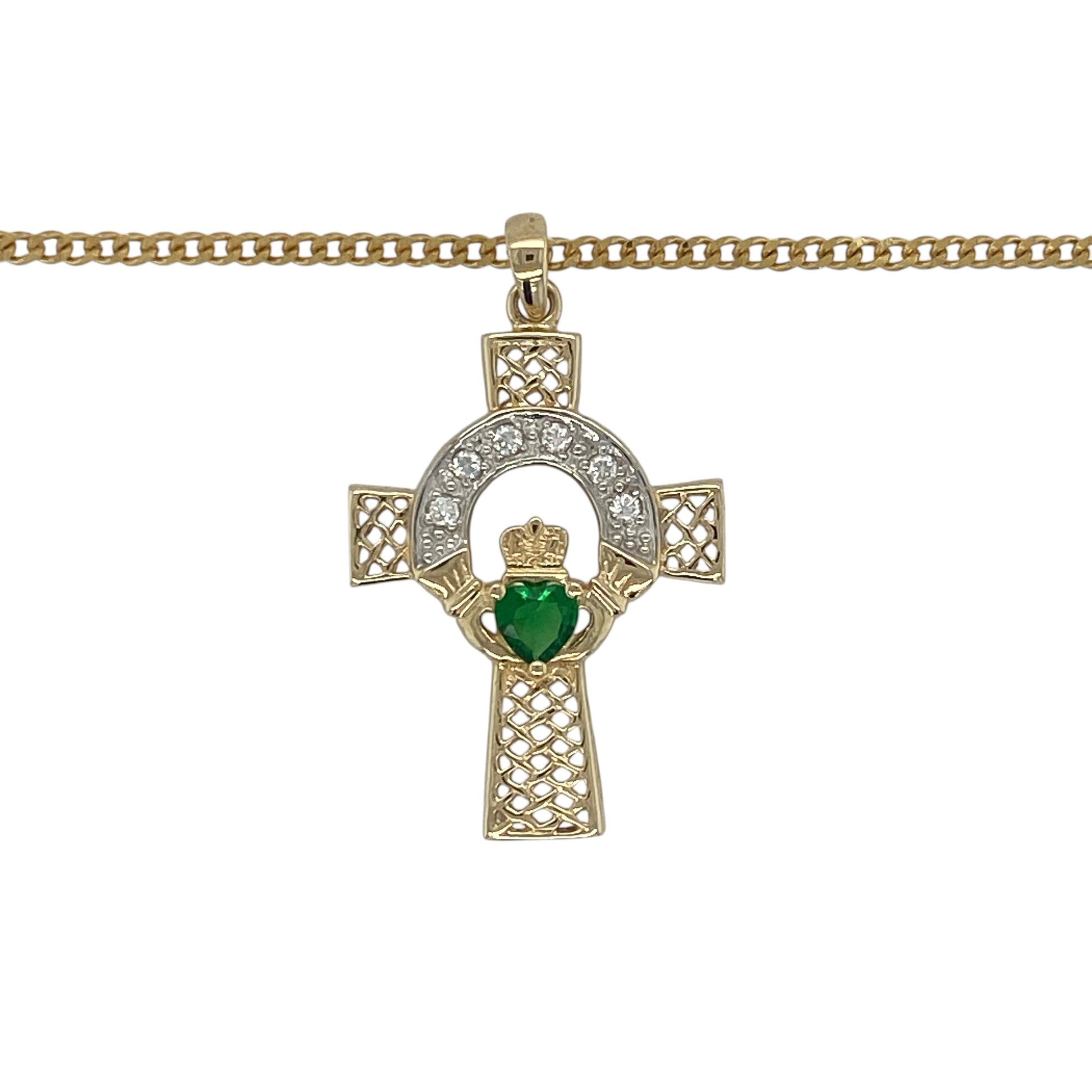 Celebrate heritage, faith, and love with this pre-owned 9ct yellow gold emerald-coloured heart stone and cubic zirconia Celtic Claddagh cross pendant necklace. Combining meaningful Celtic symbolism with sparkling details, this striking piece makes a beautiful and distinctive addition to any jewellery collection.

Design: The pendant features an intricate Celtic Claddagh cross design, incorporating traditional Celtic knotwork alongside the iconic Claddagh symbol of love, loyalty, and friendship.