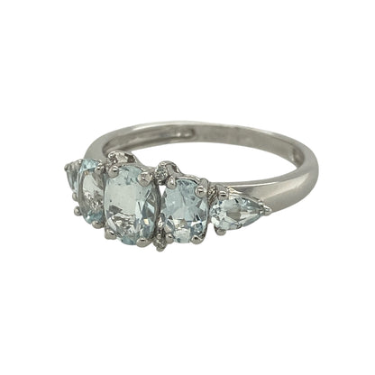Add a beautiful touch of colour and sparkle to your jewellery collection with this pre-owned 9ct white gold diamond and aquamarine-style band ring. Featuring an elegant arrangement of aquamarine-coloured stones accented with diamonds, this eye-catching ring combines graceful design with timeless sophistication.

Design: The ring showcases a striking multi-stone band design, centred with three oval aquamarine-coloured stones.