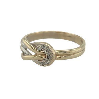 Add a meaningful touch of elegance to your jewellery collection with this pre-owned 9ct yellow gold diamond knot ring. Featuring a classic knot design enhanced with sparkling diamond accents, this beautiful ring symbolises enduring love, unity, and connection.

Design: The ring showcases an attractive knot motif across the front, measuring approximately 7mm in height.